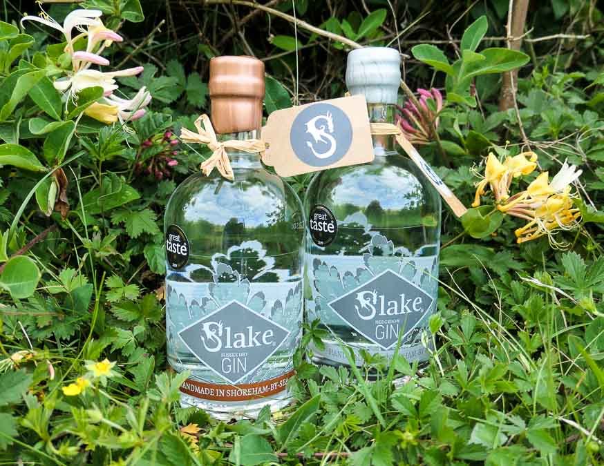 Sussex Gins - two bottles of Slake Gin set in grass and honeysuckle