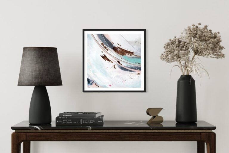 Framed abstract hand embellished print on a wall with turquoise, blue, grey and black colouring