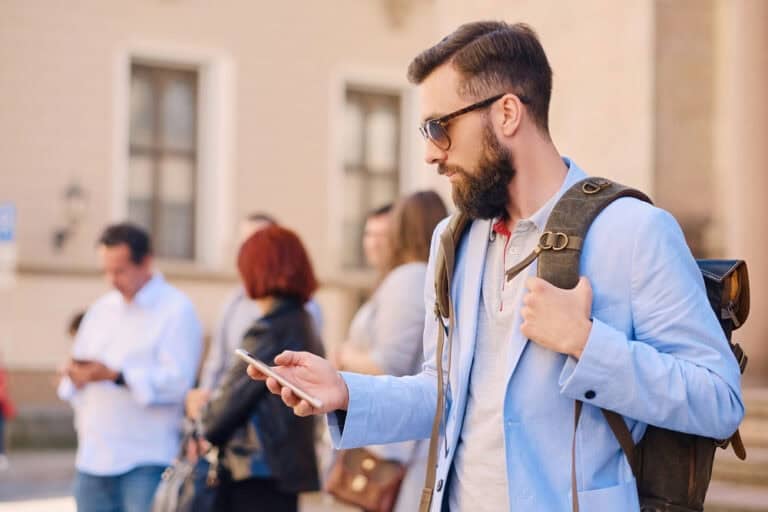 Male traveller with smart phone